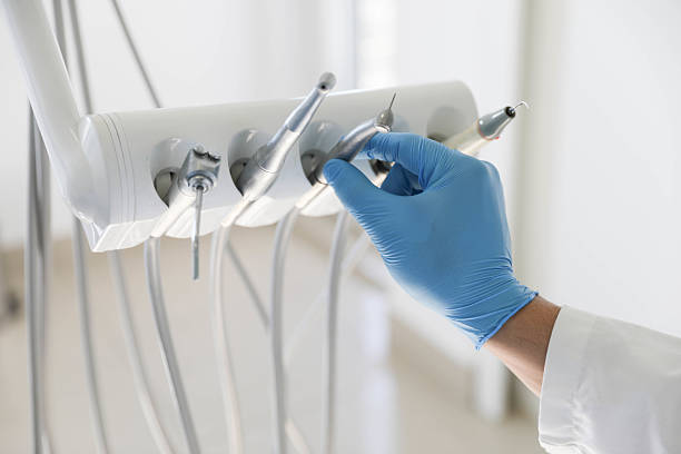 Professional Tooth Extraction technician working in West Orange, TX